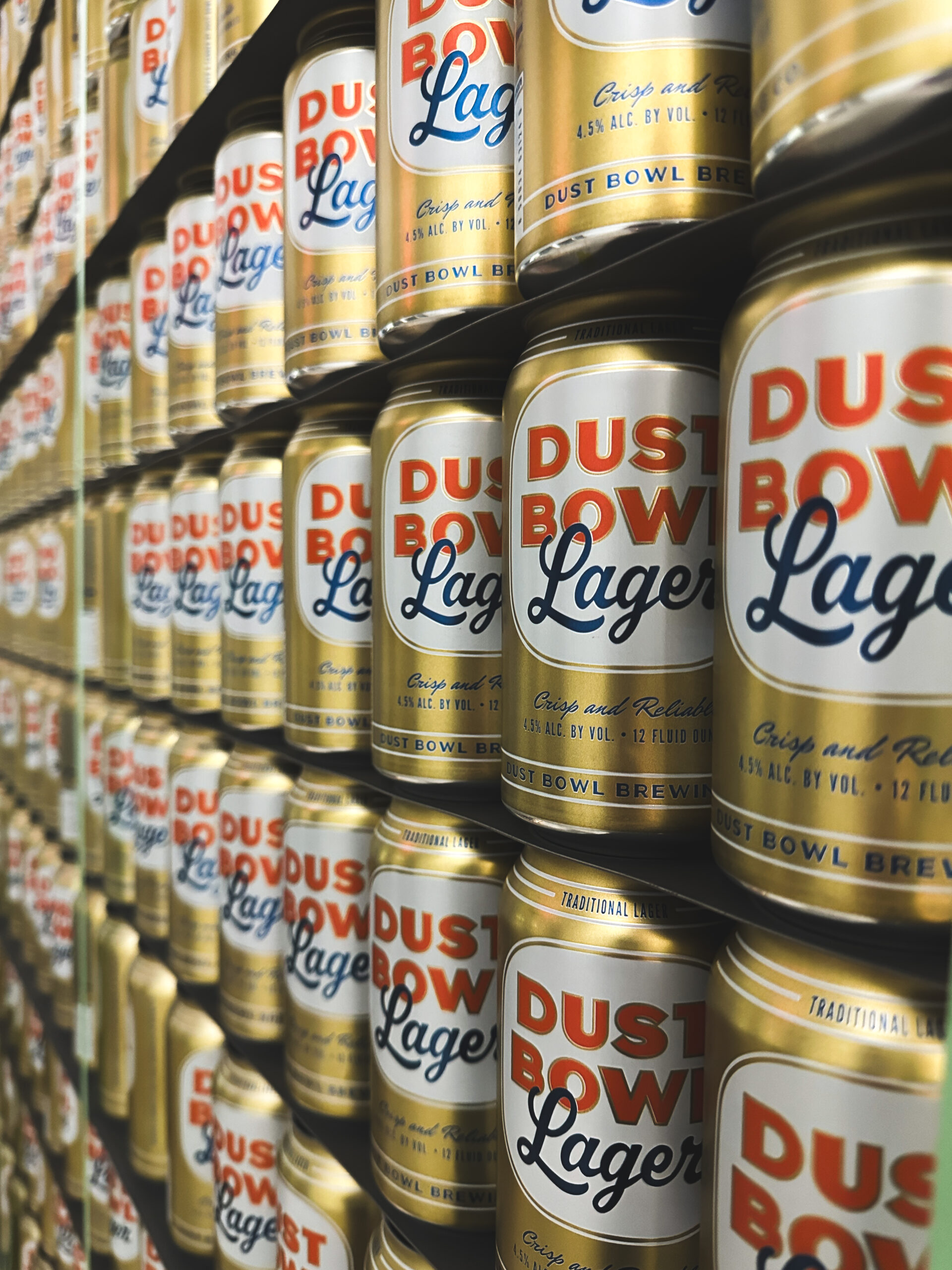 Lined up and stacked cans of Dust Bowl Lager