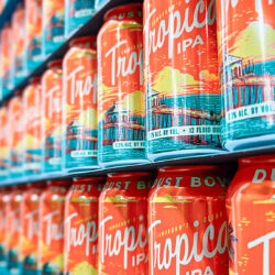 Stacked rows of Tomorrow's Clear Tropical IPA cans